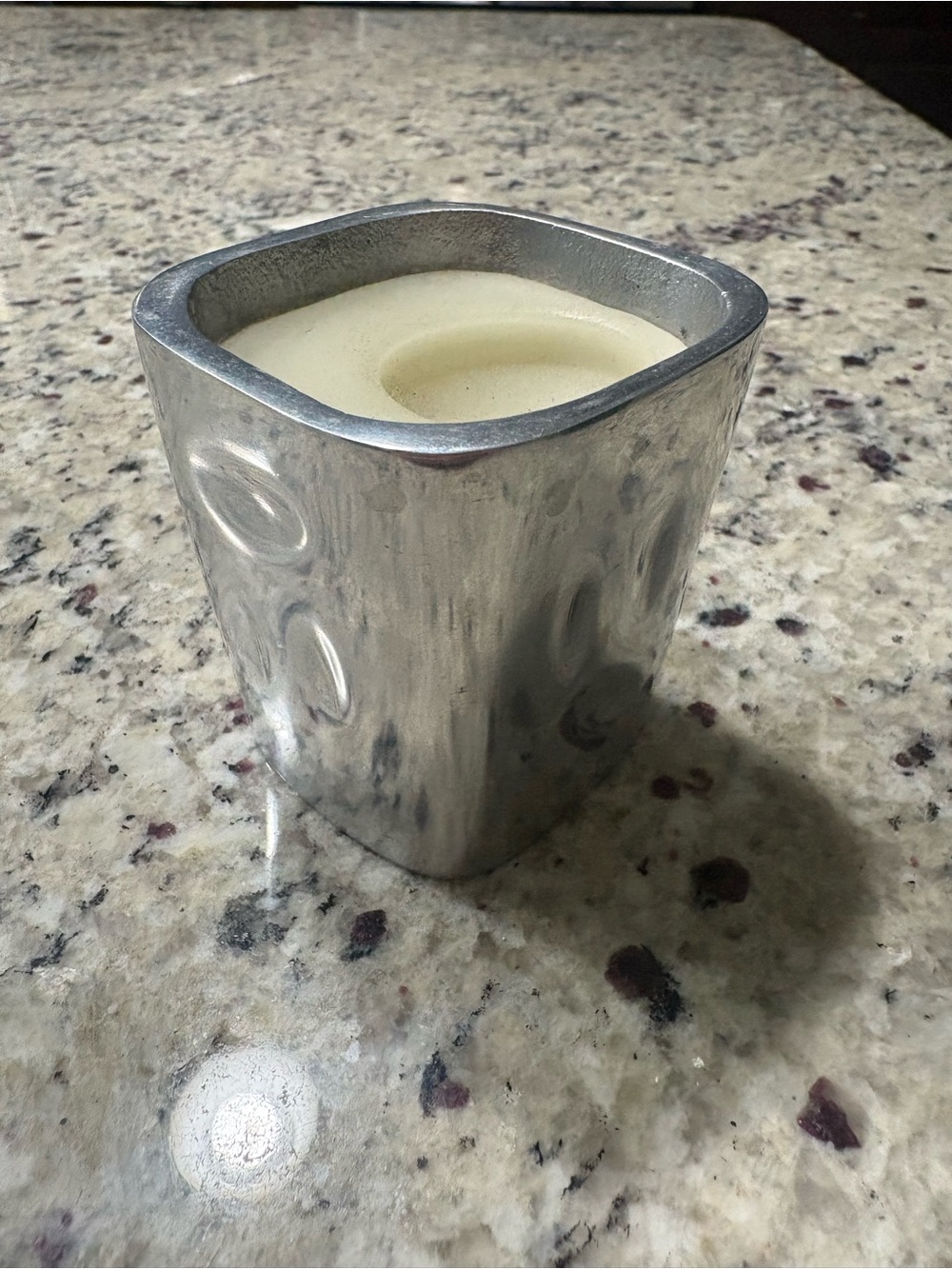 Candle in silver metal holder Used once